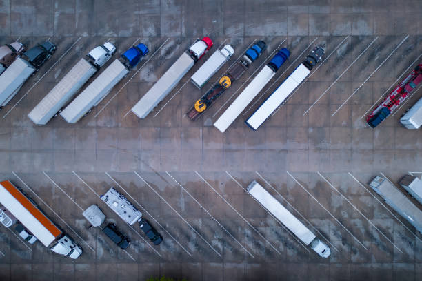 istock Trucks on a parking lot. Rest Area on a highway road 1477543394
