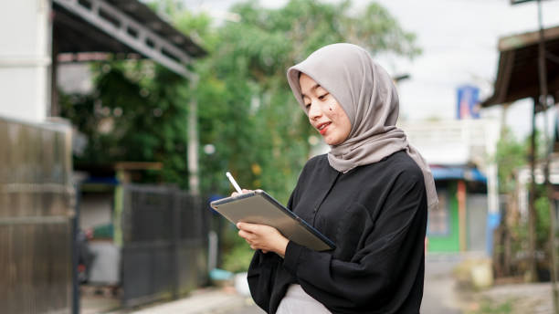 istock young hijab women using tablet in outdoor 1477544922