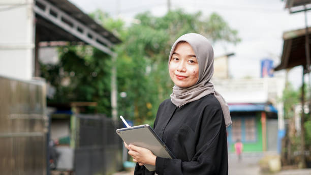 young hijab women using tablet in outdoor