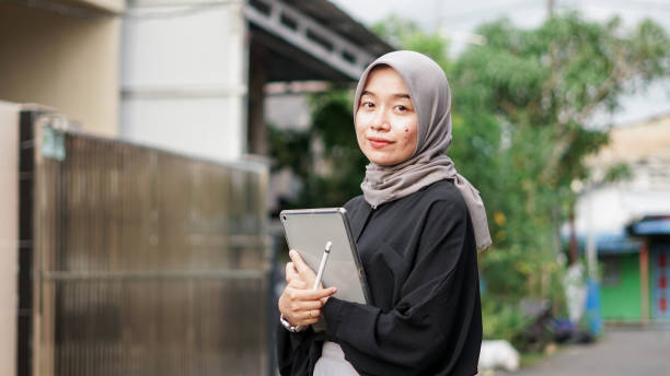 istock young hijab women using tablet in outdoor 1477545387