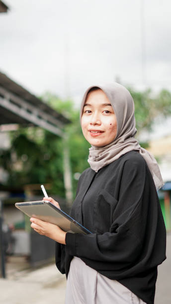 istock young hijab women using tablet in outdoor 1477545402
