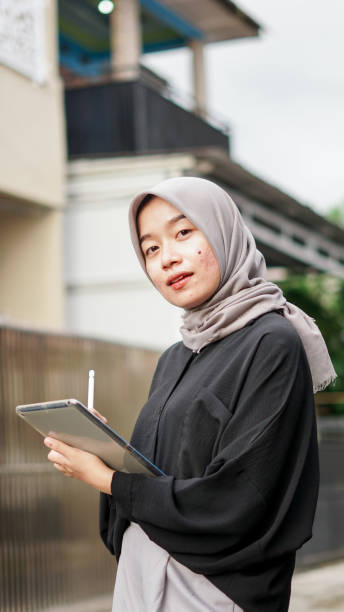 istock young hijab women using tablet in outdoor 1477545469