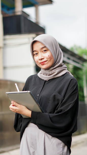 istock young hijab women using tablet in outdoor 1477545541