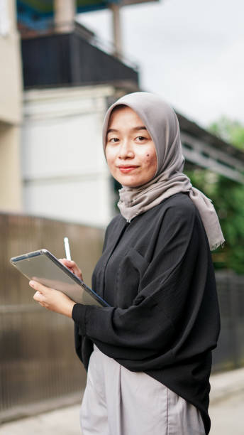 istock young hijab women using tablet in outdoor 1477545561