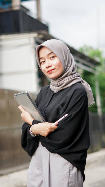 istock young hijab women using tablet in outdoor 1477545590