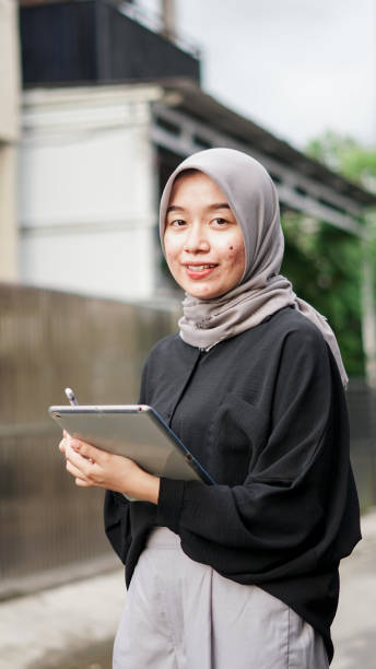 istock young hijab women using tablet in outdoor 1477545697
