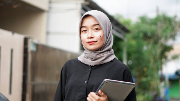 istock young hijab women using tablet in outdoor 1477545747