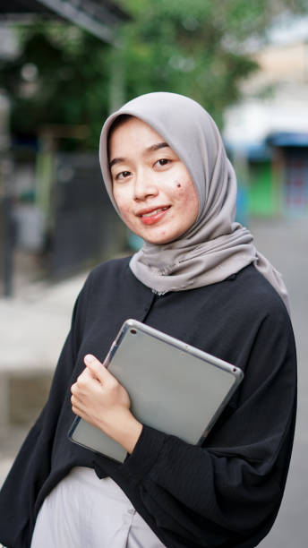 istock young hijab women using tablet in outdoor 1477545786