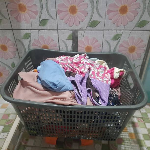 istock pile dirty clothes in the clothes basket 1477545789