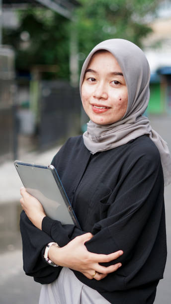 istock young hijab women using tablet in outdoor 1477545795