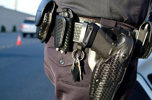 a close up of a police officer's duty belt.