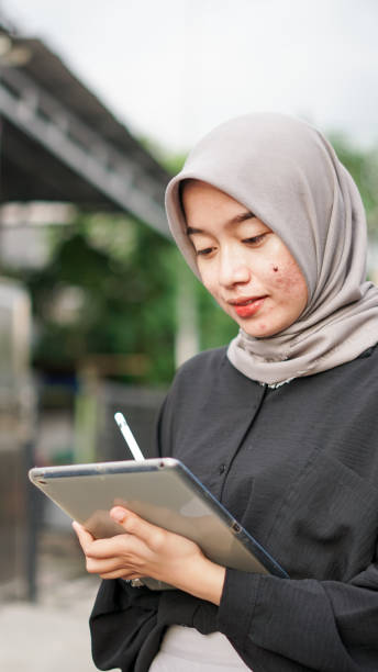 istock young hijab women using tablet in outdoor 1477547222