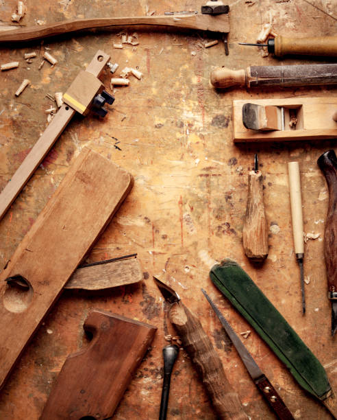 istock Hand tools Wood (Drill Jig Saw plane chisel) on an old wooden workbench 1477548541
