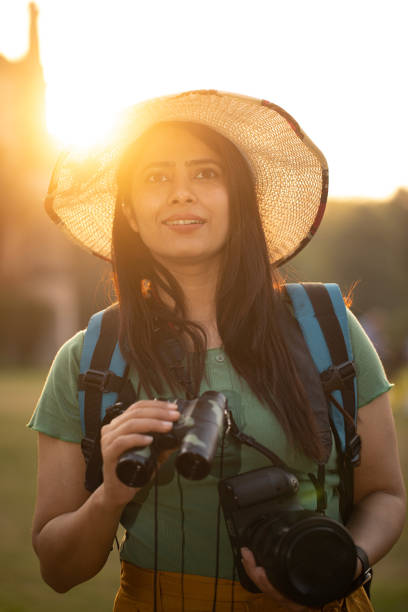 istock Young woman with camera at historic site during vacation 1477551915