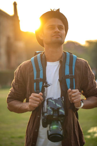 istock Thoughtful man with camera at historic site during vacation 1477552131