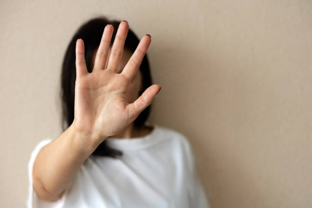 istock woman shows stop sign with hand 1477553603
