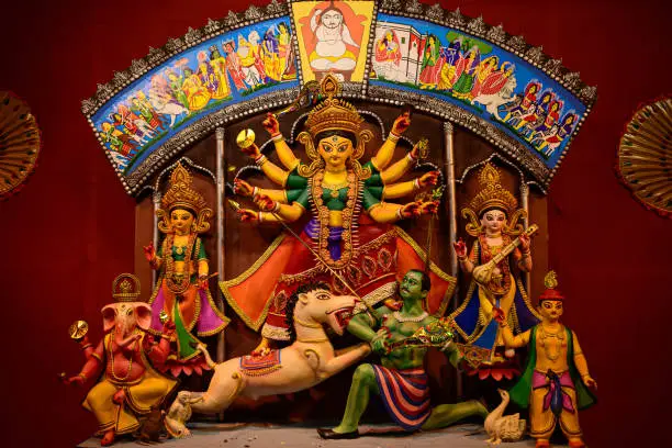 Photo of Goddess devi Durga idol decorated at a puja pandal in Kolkata, West Bengal, India. Durga Puja is one of the biggest religious festivals of Hinduism and is now celebrated worldwide.