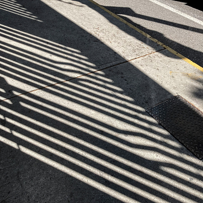 Abstract and interesting shadows of fences in the streets of Caracas city. Images made with a mobil phone