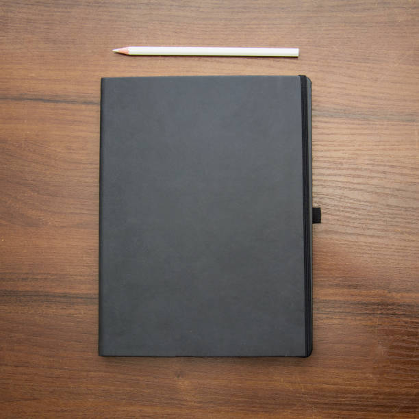 istock A beautiful pencil lies on a large notebook 1477555174