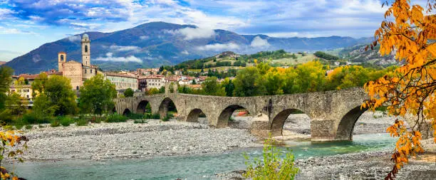 Photo of Bobbio - beautiful medieval village (borgo) of Emilia-Romagna in Italy. Panorama of old town and ancient bridge