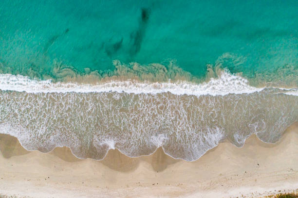 istock Aerial view of sandy beach and blue ocean with unique shoreline pattern 1477559855