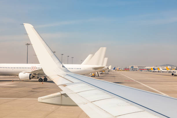 istock unbranded planes parked at the airport. 1477564285