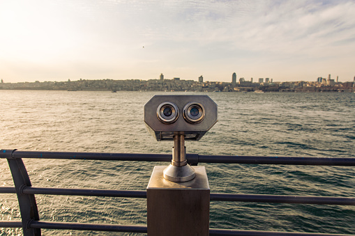 Bosphorus and surveillance binoculars. Sunset hours, a wavy sea of ​​Istanbul. Perfect view.