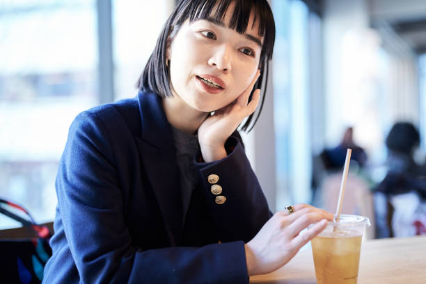istock Young woman relaxing in a cafe 1477565760
