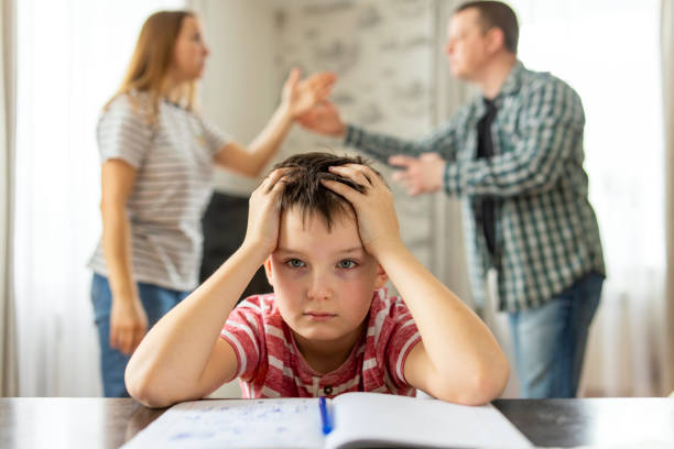 istock A son feels frustrated while his parents fight in the background 1477566178