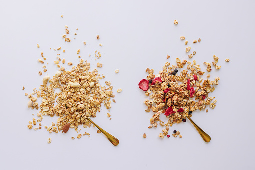 Two types of homemade granola on a white background.