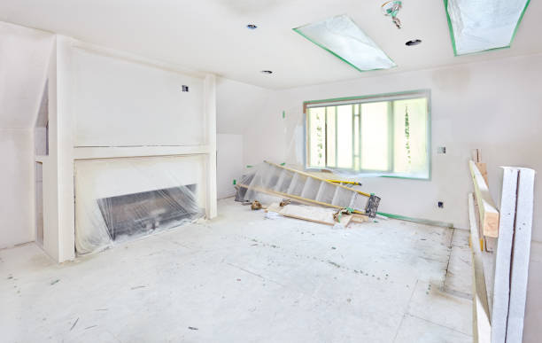 Texturing drywall Splatters of drywall texture cover protective plastic wrap in media room and still-damp patches indicate more drying time needed drywall fireplace stock pictures, royalty-free photos & images