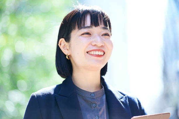 istock A young smiling woman portrait 1477570719