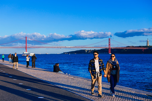 Lisbon, Portugal - January 2018 couple of tourists  walk and admire the view
