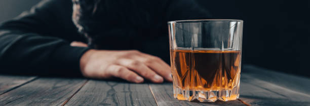 istock sad man with glass of alcohol 1477573399