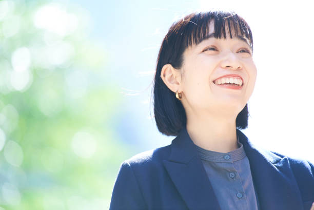 istock A young smiling woman portrait 1477573436