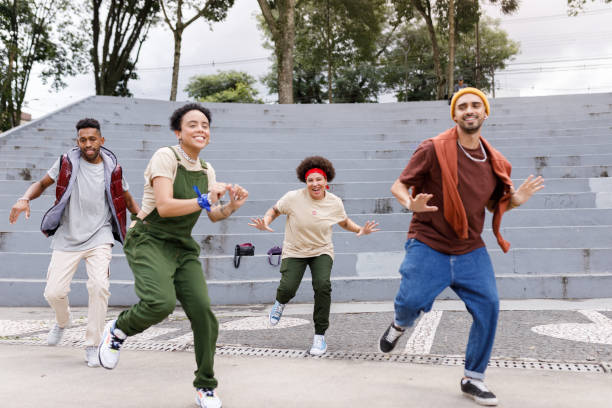 istock Dance crew showing off dance moves 1477573898