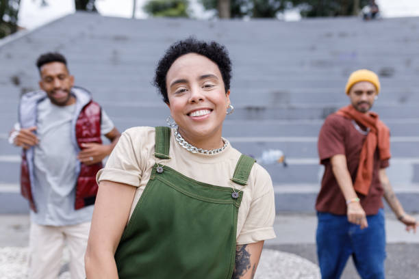 istock Smiling woman dancing with her friends 1477574469