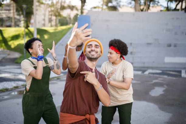 istock Man taking a selfie with his friends 1477574772