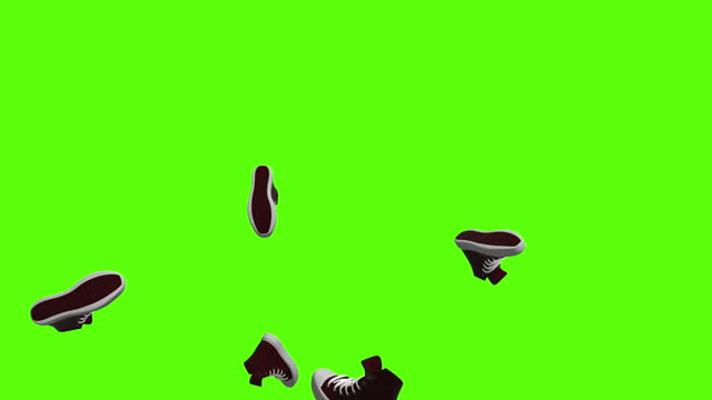 Sneakers or slippers shoes background. Falling red sneakers over green screen or chroma key. Rain of sneakers across the screen.
