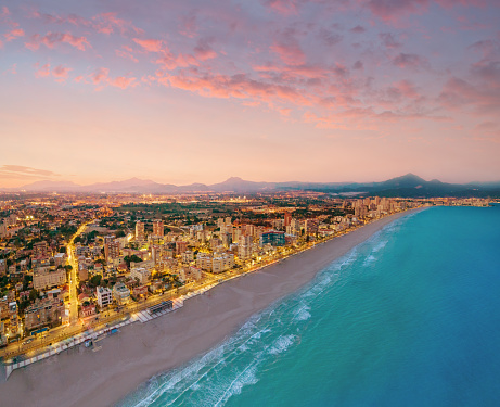 Campello beach at sunset in Alicante drone aerial view in Mediterranean sea of Spain at Costa Blanca