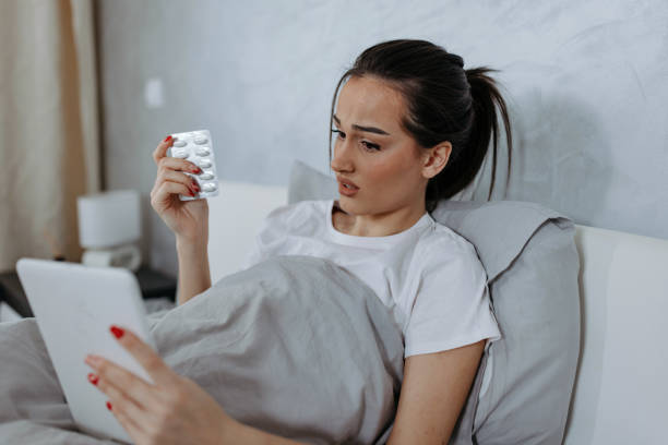 istock Woman Connects with Doctor from Bed Using Digital Tablet 1477578694