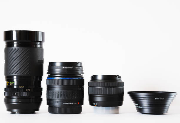 istock Group of lenses lined up next to filter adapters, on white background, photography theme, visual communication 1477580526