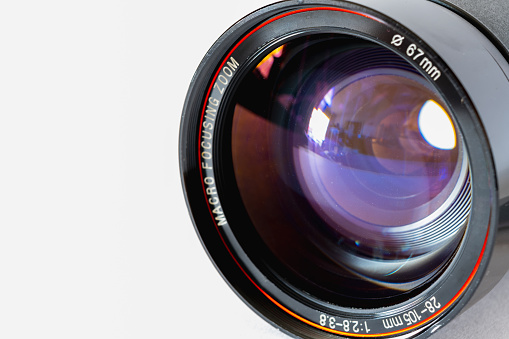 Photographic lens from macro view on white background, photography theme, visual communication, left side view