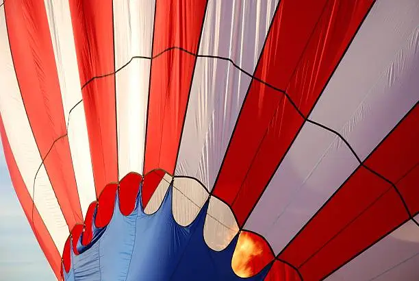 Close-up of a Hot Air Balloon heating up and inflating just before lifting off. Photo taken at St. Jean sur Richelieu, Quebec, Canada.