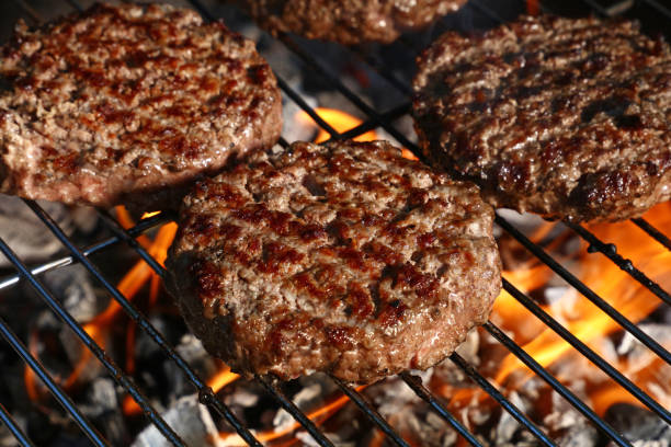 istock Beef burger for hamburger on barbecue flame grill 1477582770