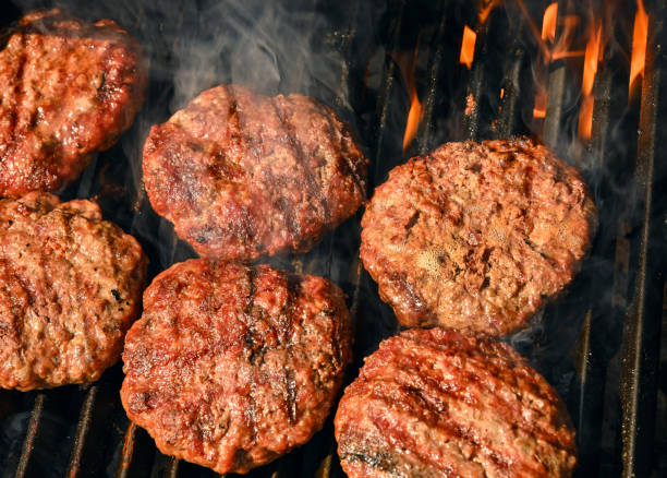 istock Beef burger for hamburger on barbecue grill 1477582783