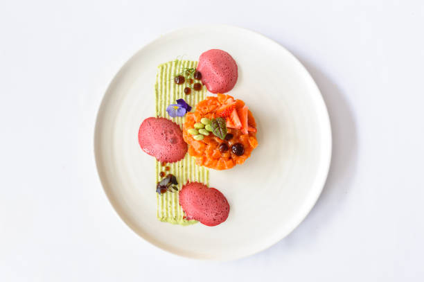 istock Salmon tartare with strawberries on a white plate 1477582904