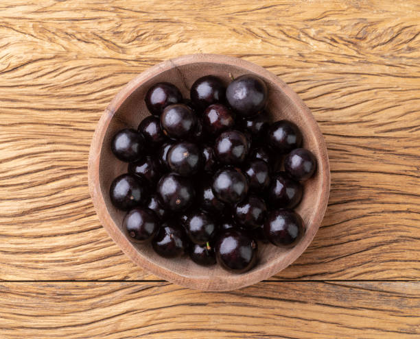 istock Jabuticabas on a bowl over wooden table 1477585201