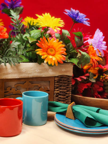 Closed Bible on table with dishes for refreshments.  Preparations for an in home Bible Study.