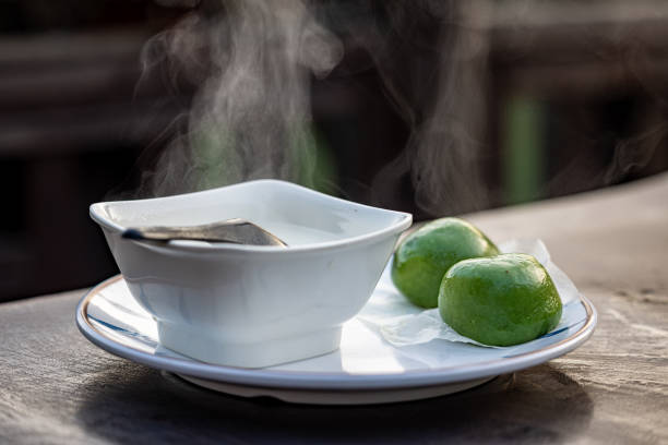 Traditional Chinese breakfast including soy milk and green dumplings stock photo